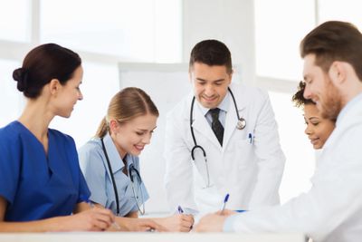 Staff looking at medical equipment - Australia