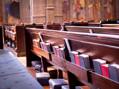 Books in church pew racks.