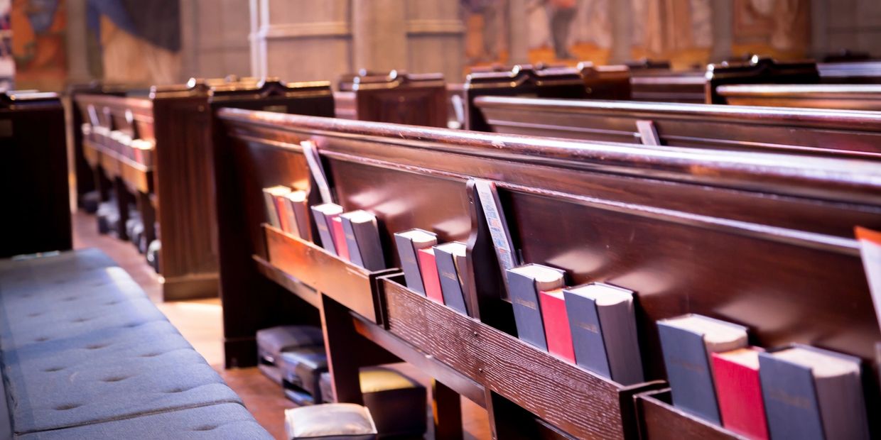church pews with hymns and bibles