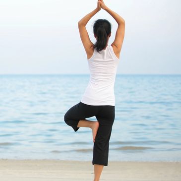 Woman standing in yoga pose