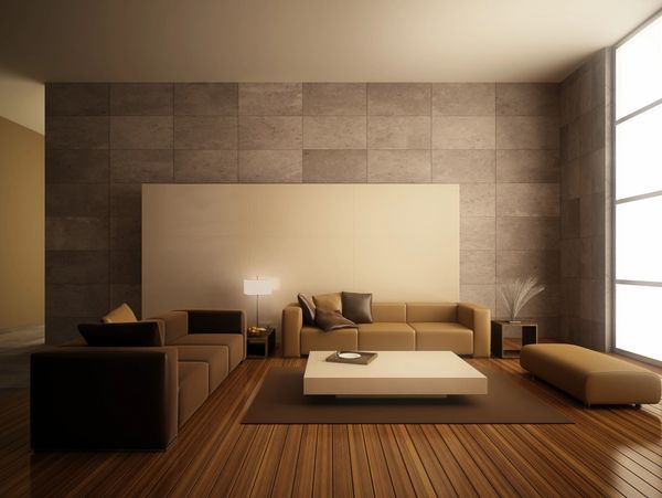 Modern living room with brown sofas and wooden flooring.