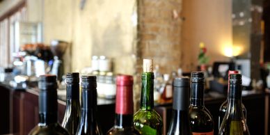 Wine bottles lined up ready for the sommelier 