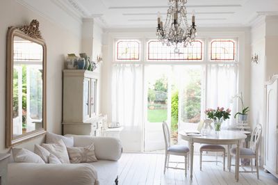 white couch and table and chairs