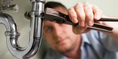 Handyman repairing sink Tampa, Florida.