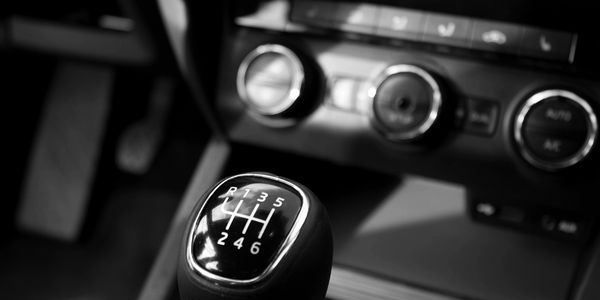 Gear shift lever with blurred dash in the background