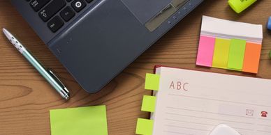 Laptop, pen, paper, organization