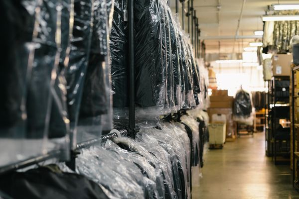 dry cleaning orders on a double conveyor