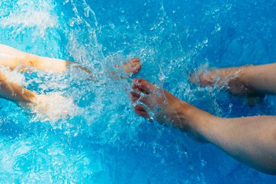 Family having fun relaxed in the pool