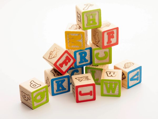 Photo of wooden blocks with alphabet. 