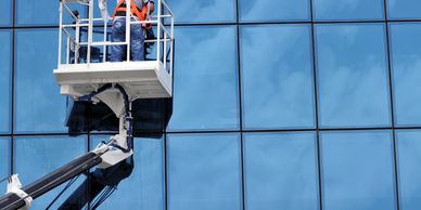 Glass technician on a boom lift. 24 hour emergency board up service.