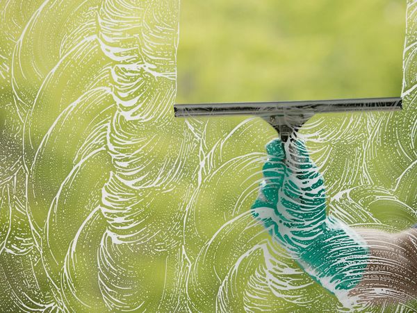 Cleaning a window.