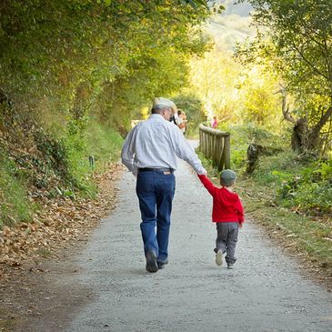 Grandpa walking with grandson, retirement planning