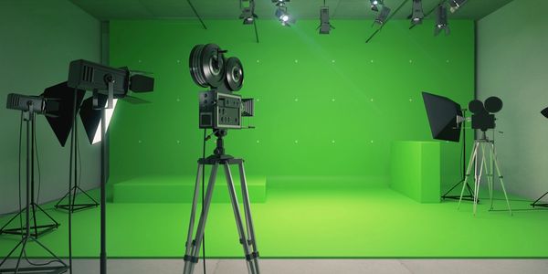 Green screen studio with camera and lights