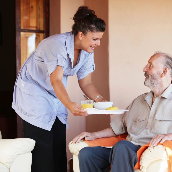 Caregiver serving food 