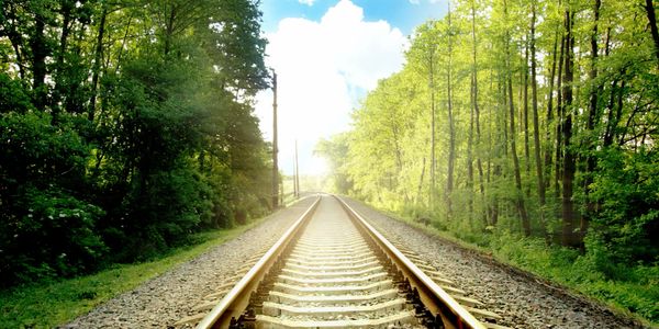 Railroad or railway line running straight into the distance