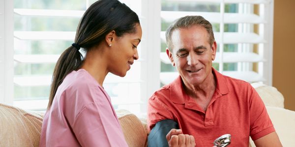 Blood pressure check by healthcare provider.