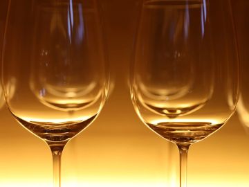 Empty wine glasses with warm backlight.