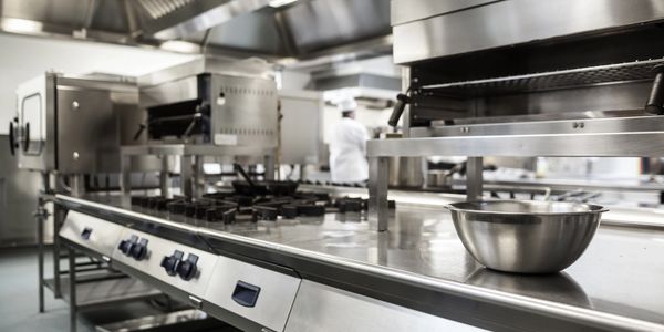 Restaurant Commercial Kitchen stainless steel equipment. Ovens, stove, refrigerators. 