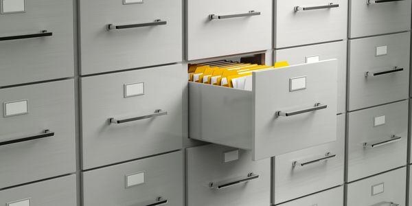 File cabinet with one drawer open.