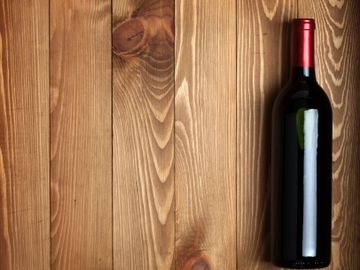 Unlabeled wine on wood table