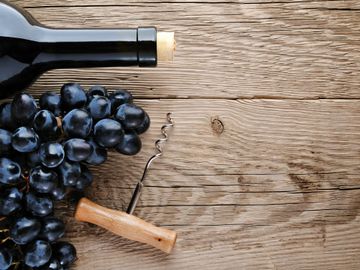 Wine, grapes and corkscrew