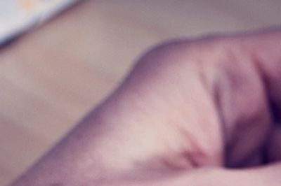 Close-up of a hand with a blurred background.