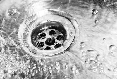 Sink drain with running water.