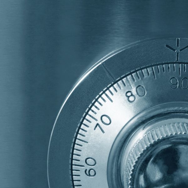 Close-up of a combination lock dial on a metallic safe.