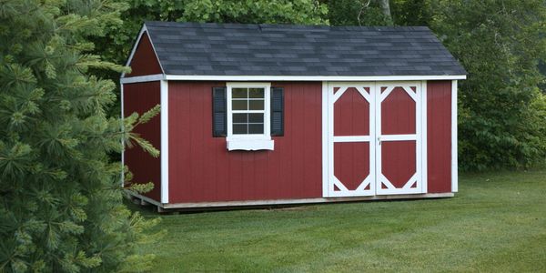 Red and white shed with window