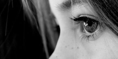 Close-up of an eye in black and white.