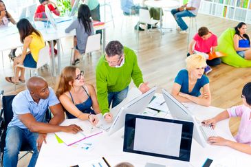 Diverse group collaborating in a bright, modern office space.