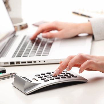 a financial expert working on a laptop