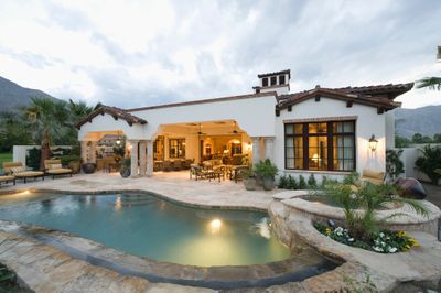 Backyard pool with house in background