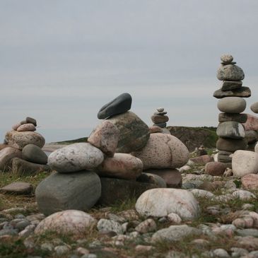 a display of different smooth edged stones stacked on top of each other