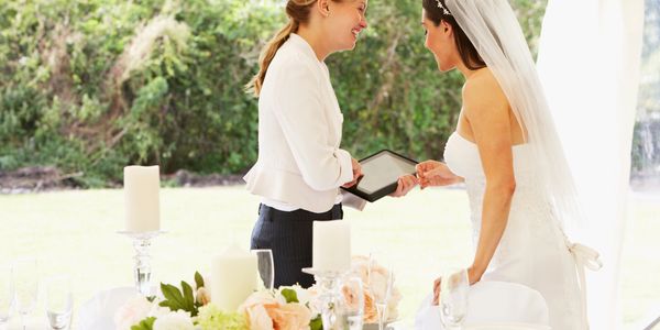 Wedding planner talking to the bride.