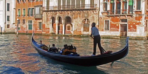 photo of a gondola on a canal in venice