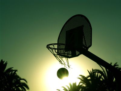 Made basket in outdoor basketball hoop on a sunny day