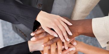 Group of people holding hands