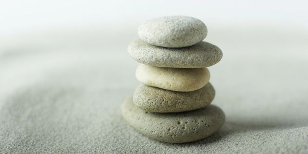 Stacked stones on sand