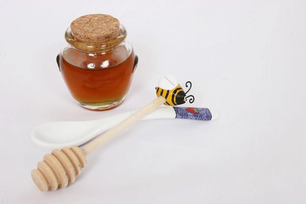 A honey jar with white Background