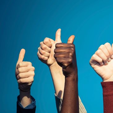 Group of hands with thumbs up