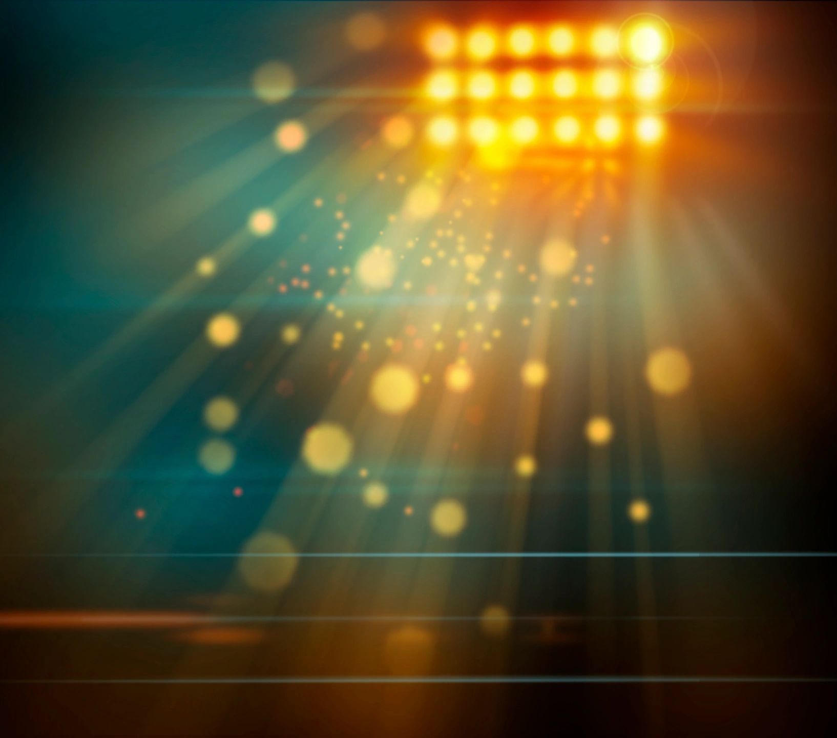 Bright stadium floodlights illuminating particles in a dark setting.