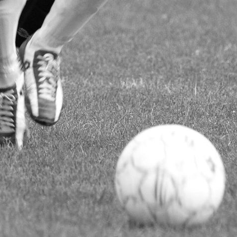 Player dribbling a soccer ball