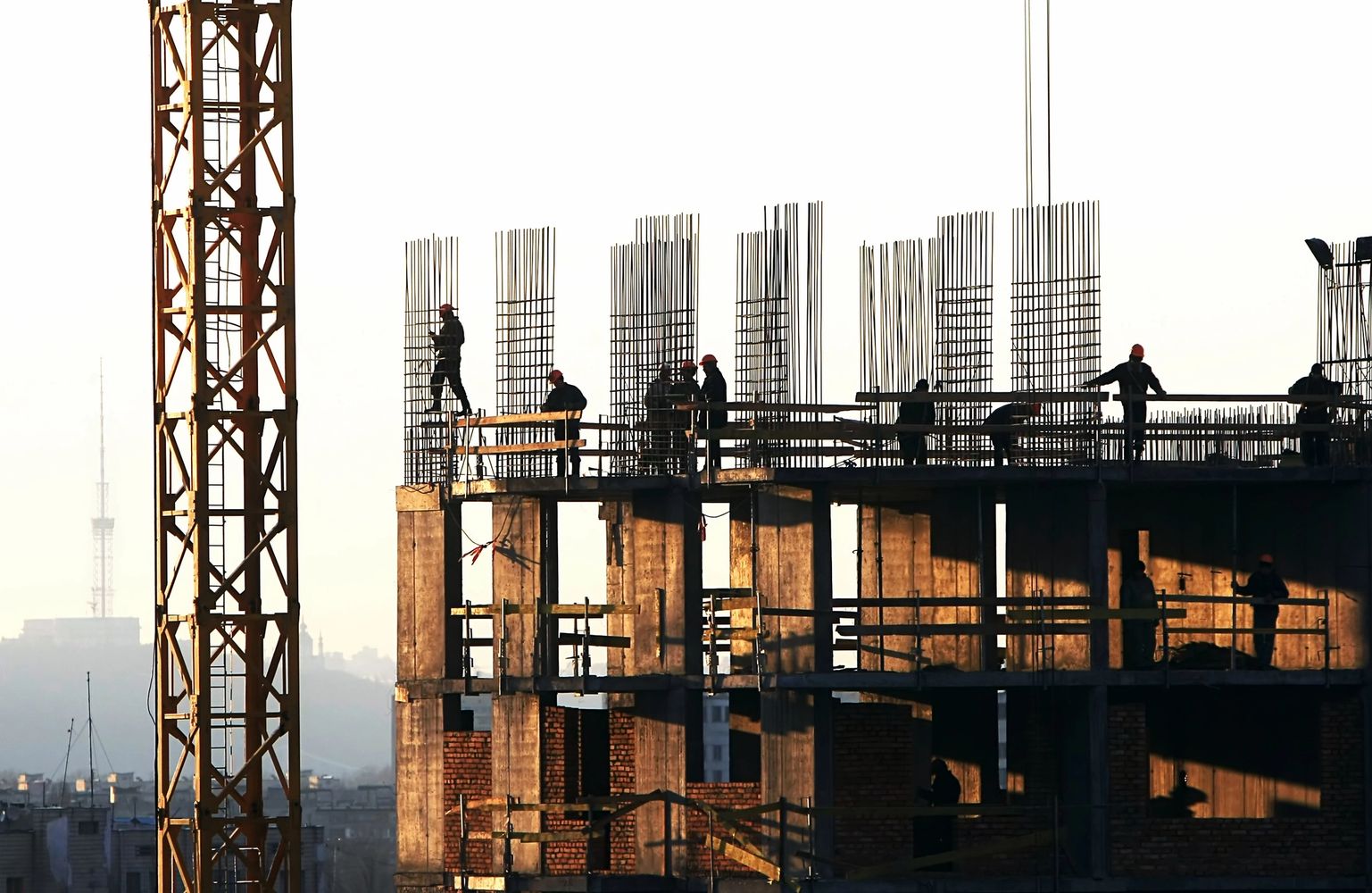 Construction of a building with multiple staff or construction engineers working on it