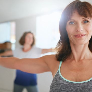 Picture is of two 40 or 50 year old women exercising