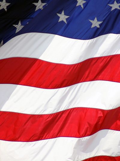 Close-up of the American flag waving in the wind.