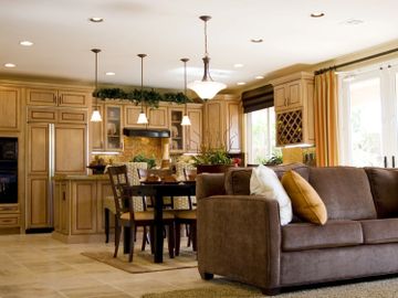 Spacious kitchen and dining area with cozy living room seating.