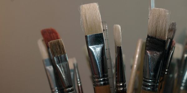 Close-up of various paintbrushes with different shapes and sizes.
