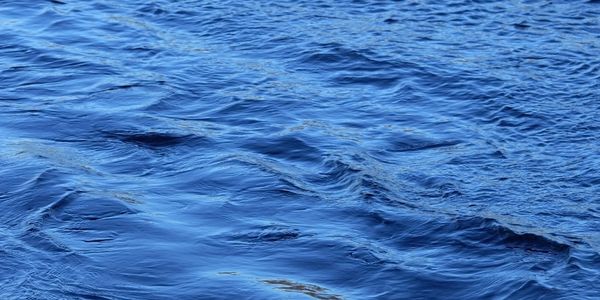 Stock photo of water surface, close up.