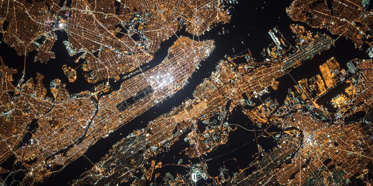 Aerial photo of a city lit up at night